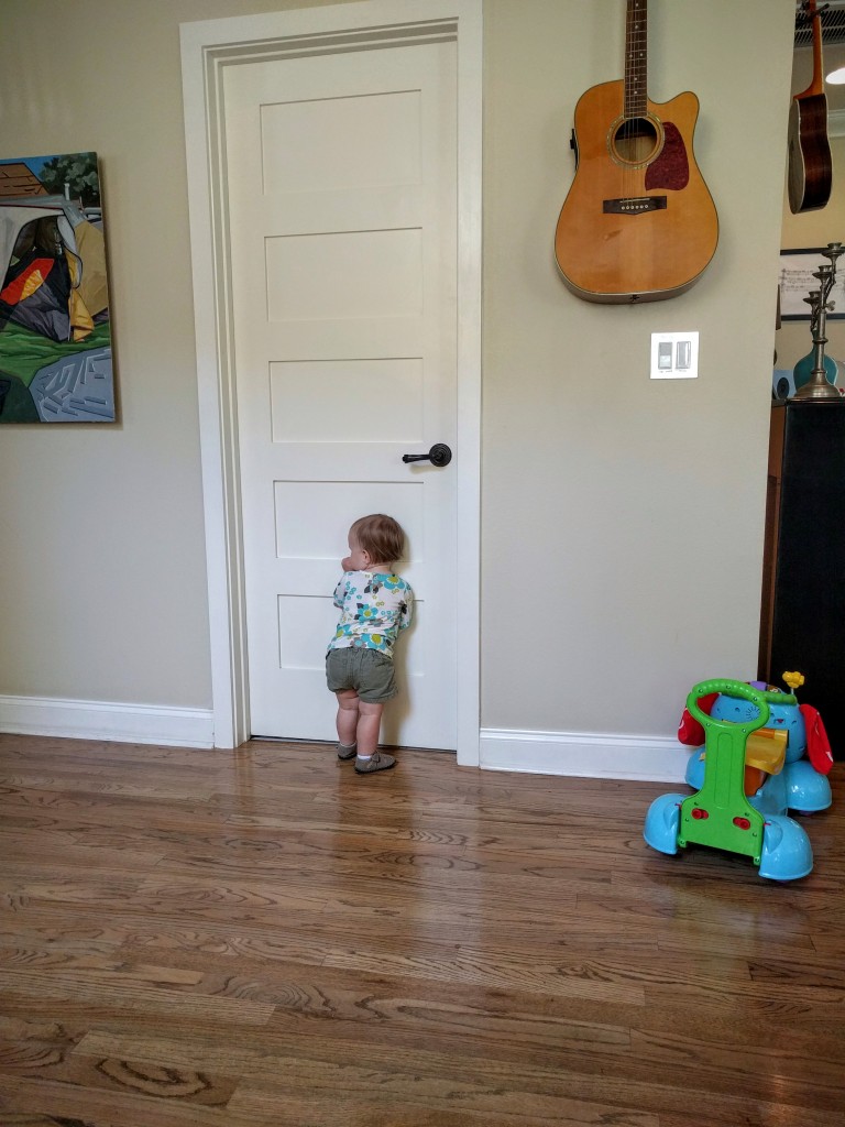 Turning into quite the daddy's girl, you wait for him while he uses the bathroom.